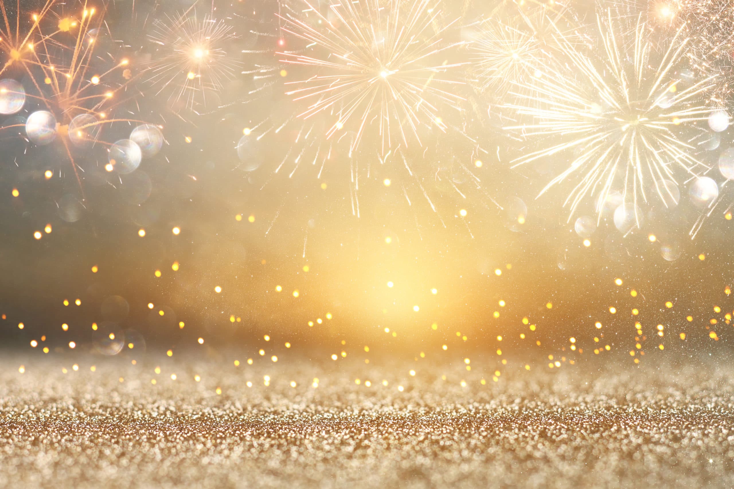 abstract gold glitter background with fireworks