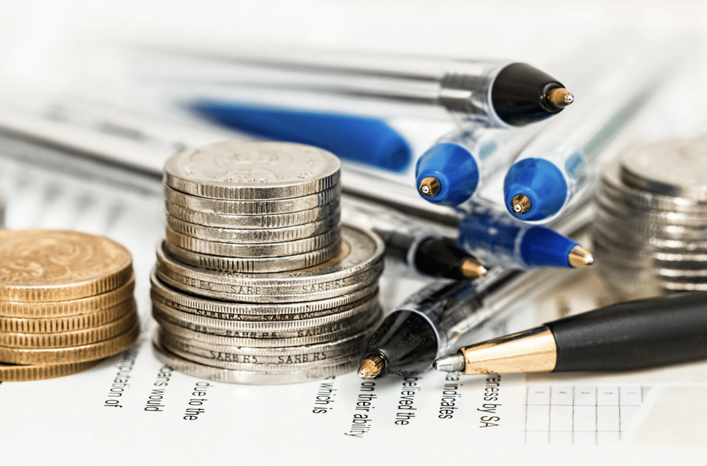 Stacked coins with pens